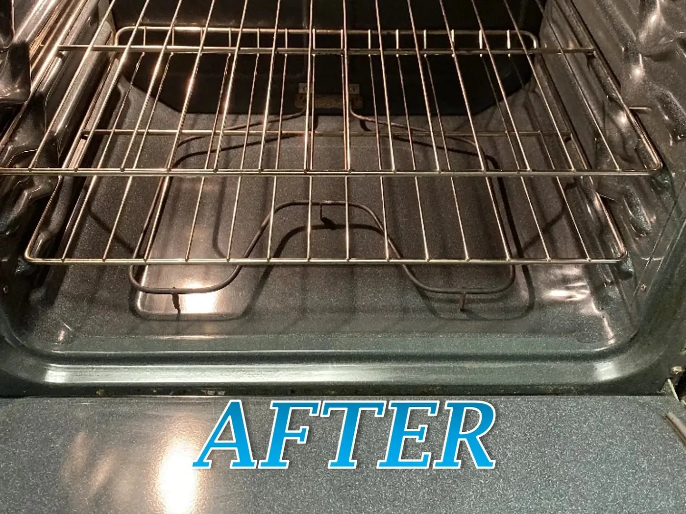 The same oven after cleaning, with the floor and racks clear